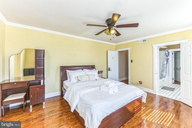 2202 E Cumberland St, Philadelphia, PA 19125 - bedroom featuring baseboards, wood finished floors, visible vents, and crown molding