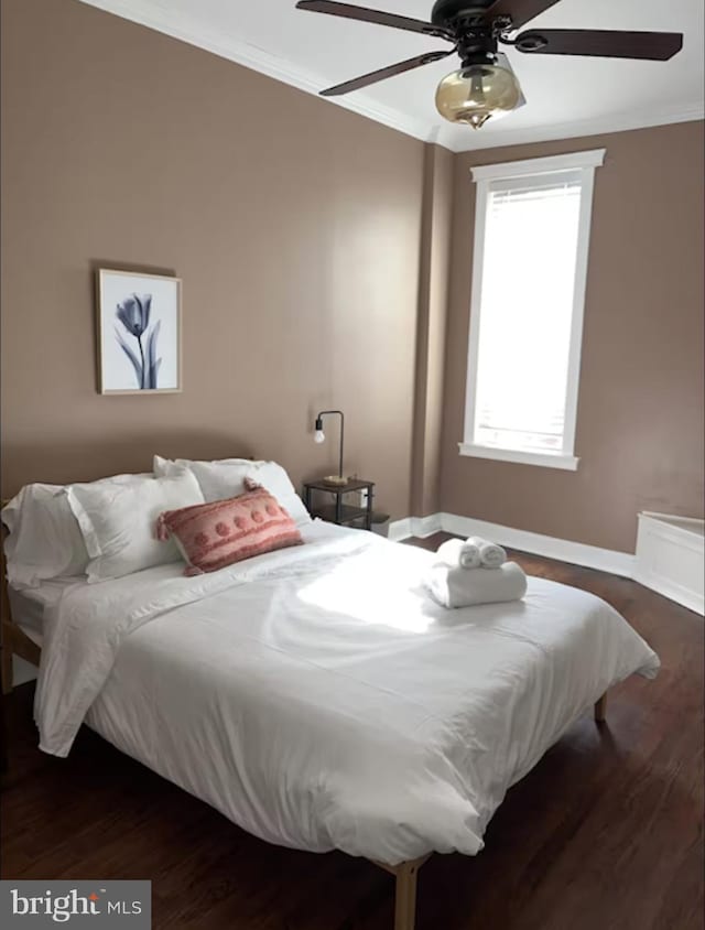 2202 E Cumberland St, Philadelphia, PA 19125 - bedroom featuring baseboards, a ceiling fan, dark wood-style flooring, and crown molding