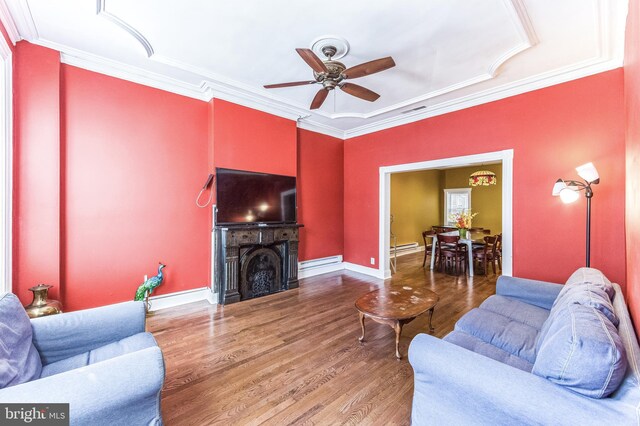 2202 E Cumberland St, Philadelphia, PA 19125 - living room featuring a baseboard radiator, wood finished floors, ceiling fan, ornamental molding, and visible vents