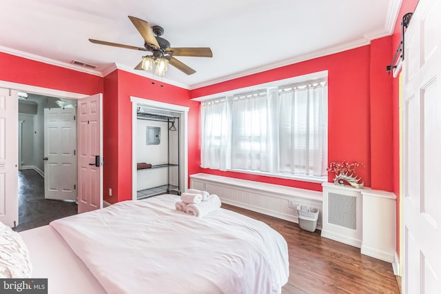 2202 E Cumberland St, Philadelphia, PA 19125 - bedroom with wood finished floors, visible vents, ornamental molding, and a ceiling fan