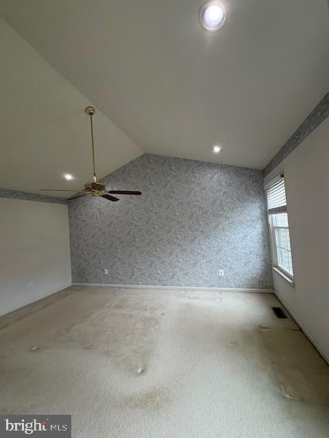 carpeted spare room with ceiling fan, vaulted ceiling, wallpapered walls, and recessed lighting