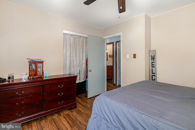 bedroom with a ceiling fan and dark wood-style floors
