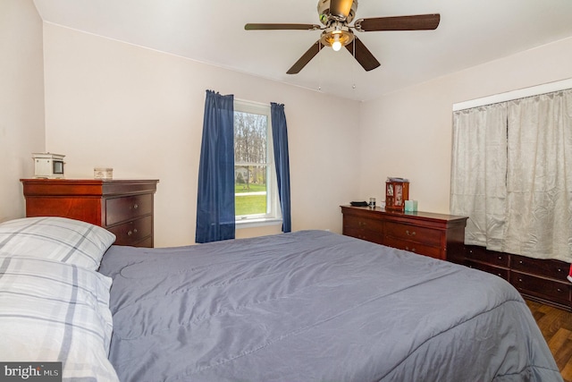 bedroom featuring a ceiling fan and wood finished floors