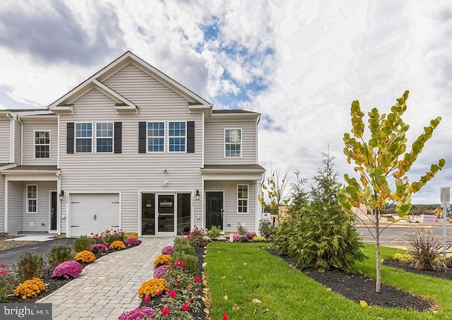 1207 Susan Cir, Breinigsville, PA 18031 - view of front of house with decorative driveway, a garage, and a front yard