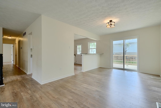 4504 E Joppa Rd, Perry Hall, MD 21128 - unfurnished room with light wood-style flooring, a textured ceiling, baseboards, and visible vents