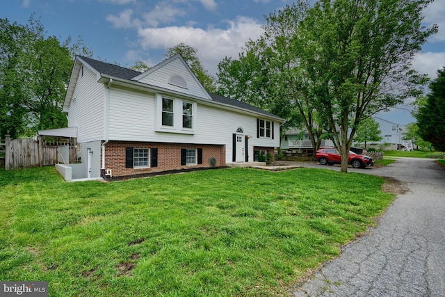 4504 E Joppa Rd, Perry Hall, MD 21128 - bi-level home with brick siding, fence, and a front yard