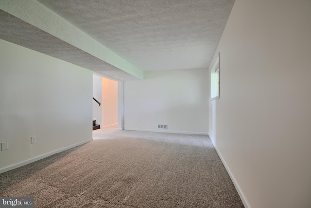 4504 E Joppa Rd, Perry Hall, MD 21128 - basement featuring stairs, a textured ceiling, visible vents, light carpet, and baseboards