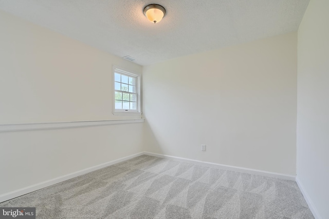 4504 E Joppa Rd, Perry Hall, MD 21128 - spare room featuring a textured ceiling, carpet, baseboards, and visible vents