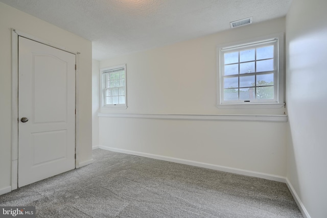 4504 E Joppa Rd, Perry Hall, MD 21128 - unfurnished bedroom with baseboards, carpet flooring, visible vents, and a textured ceiling