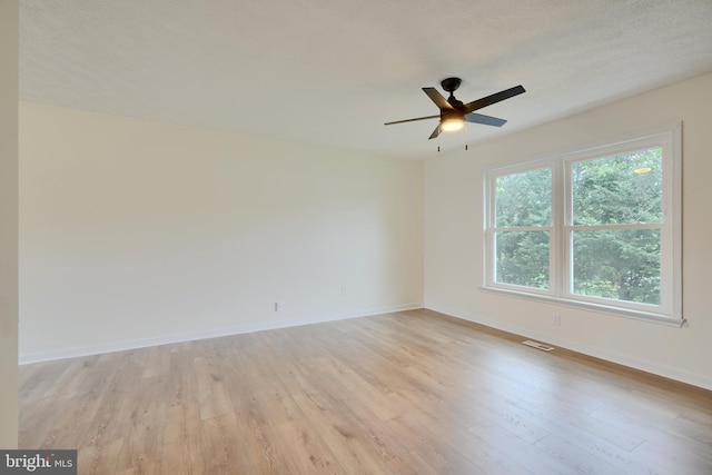 4504 E Joppa Rd, Perry Hall, MD 21128 - empty room featuring light wood finished floors, baseboards, ceiling fan, and visible vents
