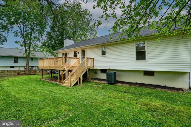 4504 E Joppa Rd, Perry Hall, MD 21128 - back of property with a lawn, fence, central air condition unit, stairway, and a wooden deck