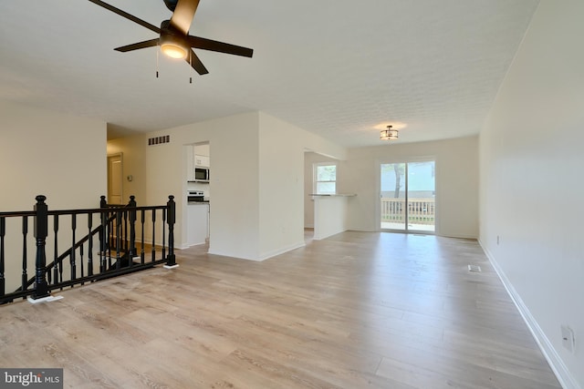 4504 E Joppa Rd, Perry Hall, MD 21128 - unfurnished room with light wood-type flooring, ceiling fan, baseboards, and visible vents