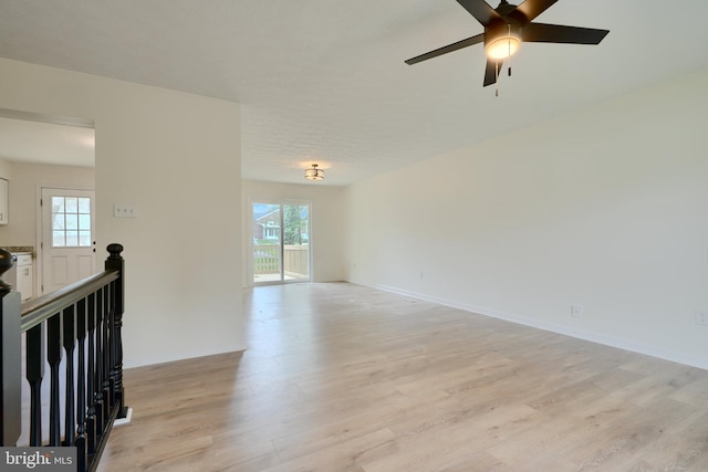 4504 E Joppa Rd, Perry Hall, MD 21128 - empty room with light wood finished floors, baseboards, ceiling fan, and plenty of natural light