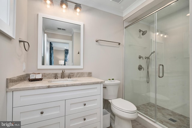 full bathroom with a shower stall, vanity, toilet, ornamental molding, and visible vents