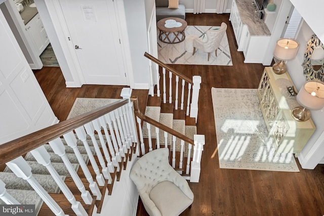 stairway with wood finished floors