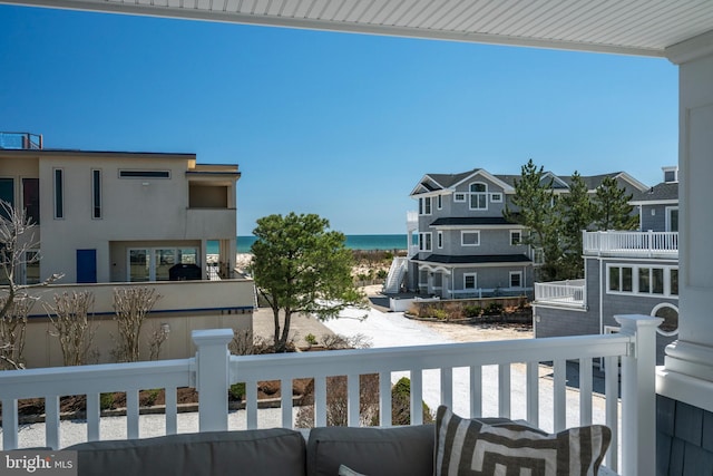 balcony featuring a water view