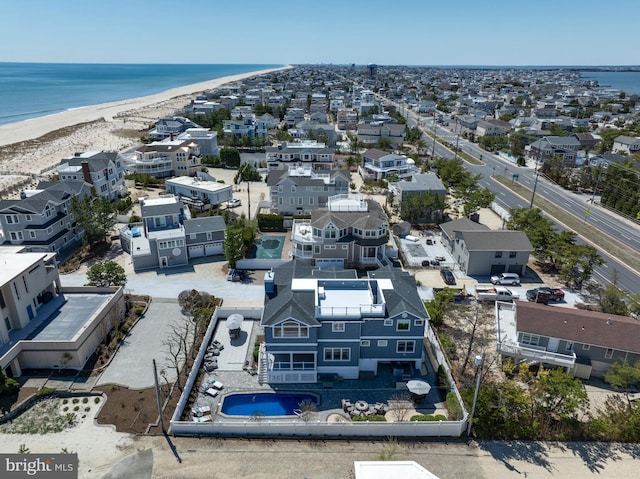 bird's eye view with a beach view, a residential view, and a water view