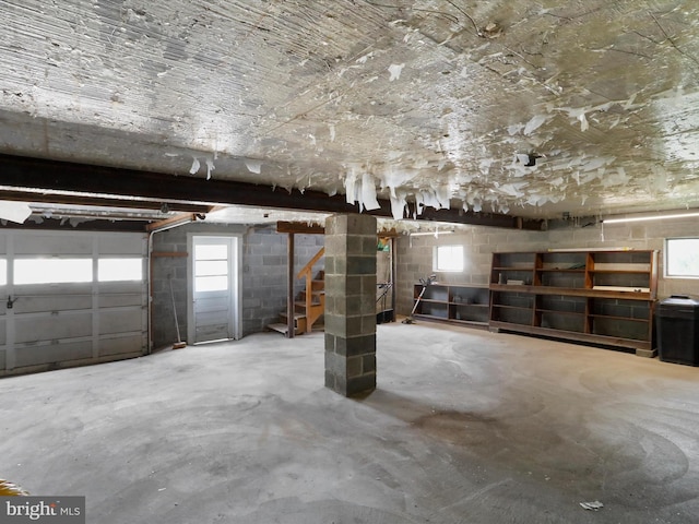 garage with concrete block wall