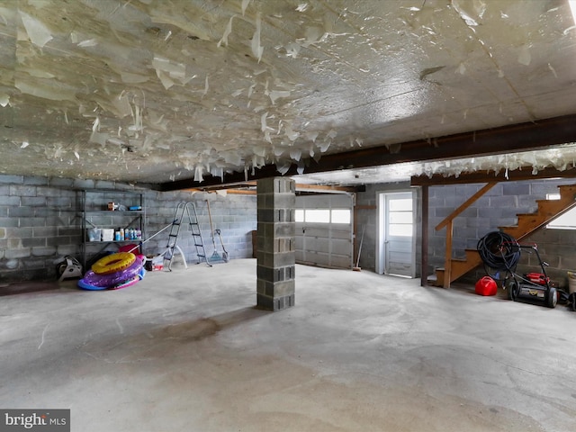 garage with concrete block wall