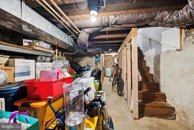 unfinished basement featuring stairway