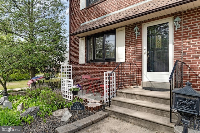 entrance to property with brick siding