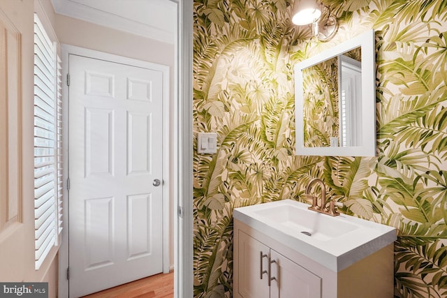 2564 S Arlington Mill Dr S Unit 5, Arlington, VA 22206 - bathroom with wallpapered walls, wood finished floors, and vanity