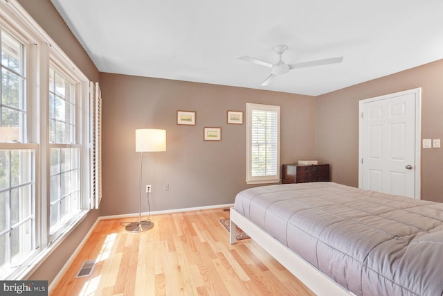 2564 S Arlington Mill Dr S Unit 5, Arlington, VA 22206 - bedroom with baseboards, wood finished floors, visible vents, and multiple windows