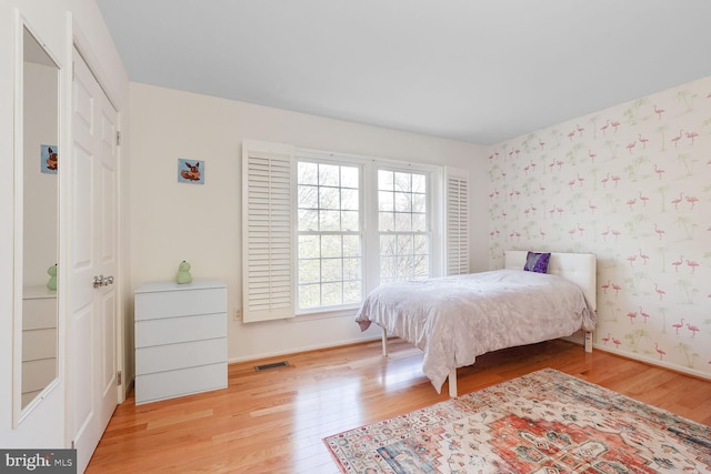 2564 S Arlington Mill Dr S Unit 5, Arlington, VA 22206 - bedroom with baseboards, wallpapered walls, wood finished floors, and visible vents