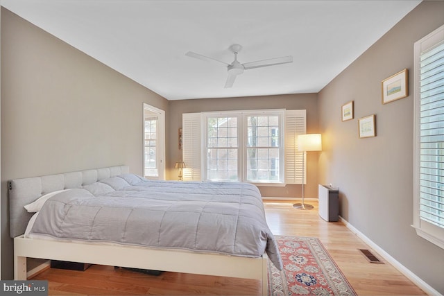 2564 S Arlington Mill Dr S Unit 5, Arlington, VA 22206 - bedroom featuring baseboards, light wood-style flooring, visible vents, and ceiling fan