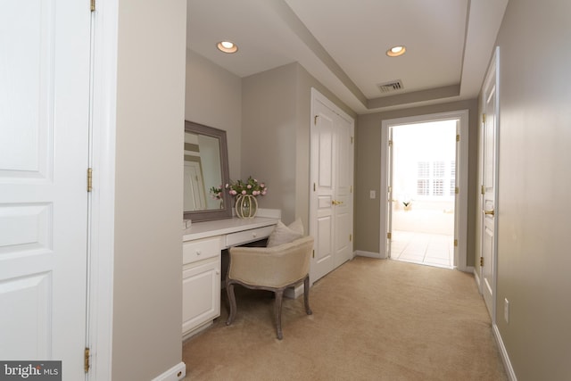 office space featuring built in desk, light carpet, recessed lighting, and baseboards