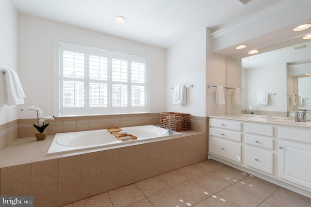 full bath with a garden tub, tile patterned floors, vanity, and recessed lighting