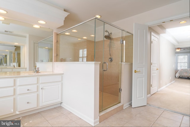 bathroom with tile patterned flooring, a stall shower, baseboards, vanity, and recessed lighting