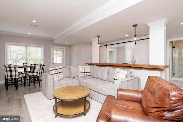 living room with recessed lighting, crown molding, light wood-style floors, and baseboards