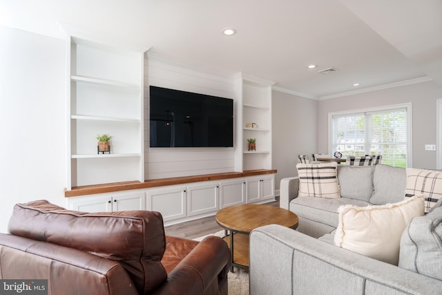 living area with crown molding, light wood finished floors, recessed lighting, and built in features