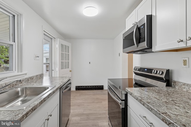 463 New Elm St, Conshohocken, PA 19428 - kitchen featuring white cabinetry, appliances with stainless steel finishes, a wealth of natural light, and a sink