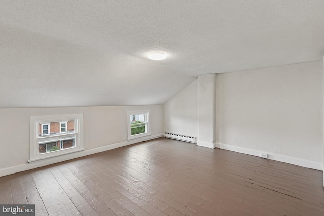 463 New Elm St, Conshohocken, PA 19428 - additional living space with hardwood / wood-style floors, baseboards, a textured ceiling, a baseboard heating unit, and vaulted ceiling