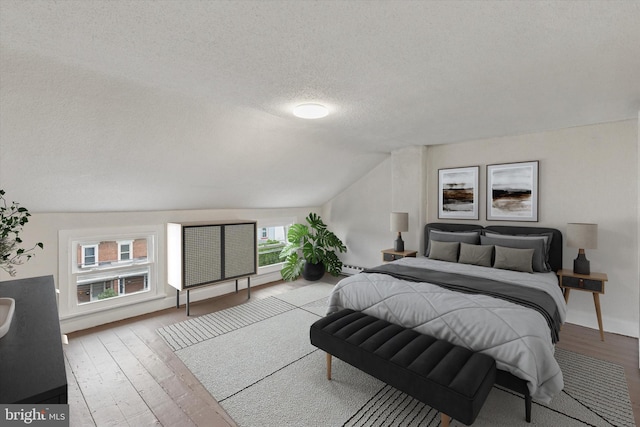 463 New Elm St, Conshohocken, PA 19428 - bedroom with vaulted ceiling, hardwood / wood-style flooring, and a textured ceiling