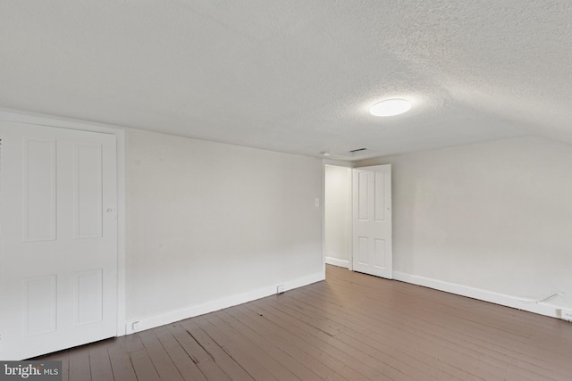 463 New Elm St, Conshohocken, PA 19428 - spare room featuring baseboards, a textured ceiling, and hardwood / wood-style flooring