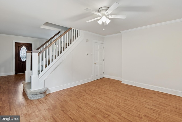 463 New Elm St, Conshohocken, PA 19428 - unfurnished living room featuring a ceiling fan, crown molding, stairway, baseboards, and light wood-style flooring