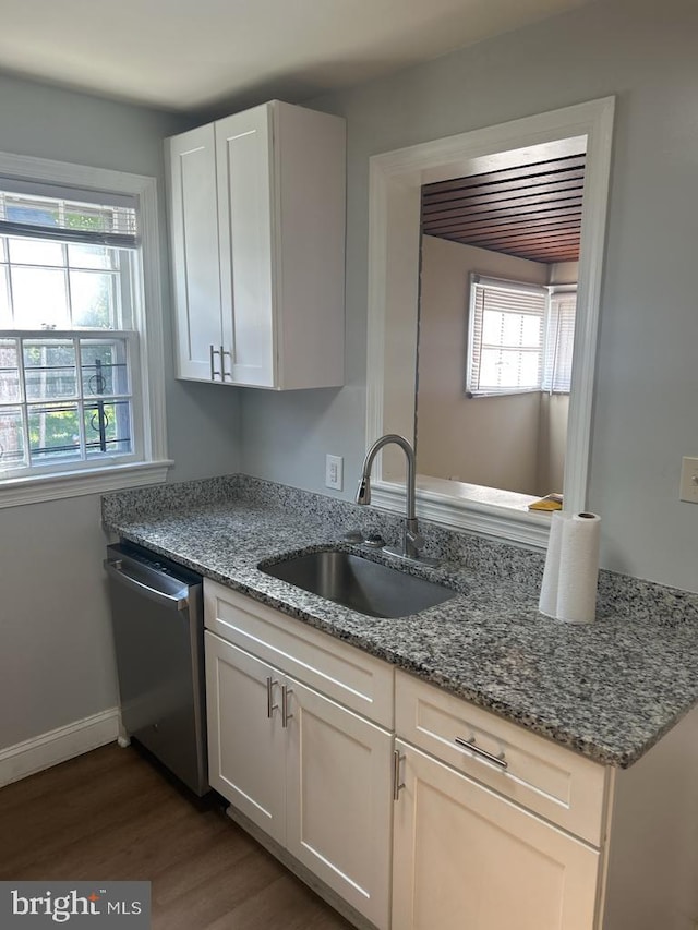 419 Larchmont Ave, Capitol Heights, MD 20743 - kitchen featuring a sink, dishwasher, stone countertops, dark wood finished floors, and baseboards