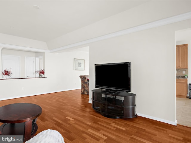 living room with light wood-type flooring and baseboards
