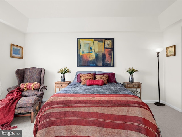 carpeted bedroom featuring baseboards