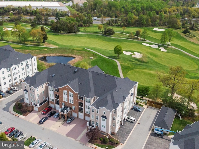 aerial view featuring a water view and golf course view