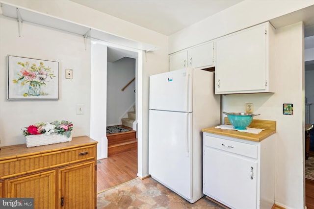 1223 Summerwood Ct, Arnold, MD 21012 - kitchen featuring white cabinets, light countertops, and freestanding refrigerator