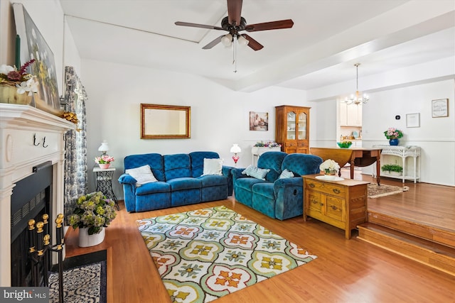 1223 Summerwood Ct, Arnold, MD 21012 - living room featuring ceiling fan with notable chandelier, wood finished floors, and a fireplace