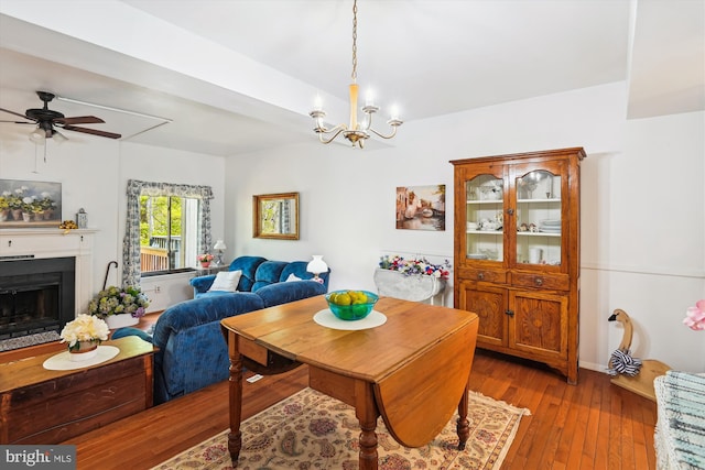 1223 Summerwood Ct, Arnold, MD 21012 - dining area featuring hardwood / wood-style flooring, a fireplace, and ceiling fan with notable chandelier