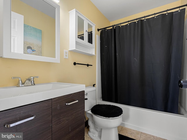 full bathroom featuring tile patterned floors, vanity, shower / bathtub combination with curtain, and toilet