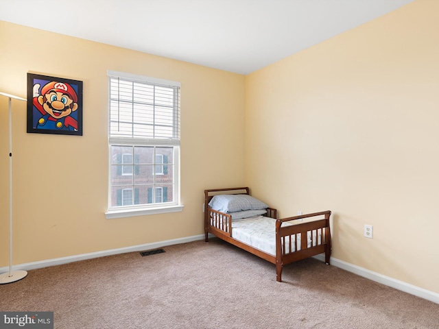 bedroom featuring visible vents, baseboards, and carpet flooring