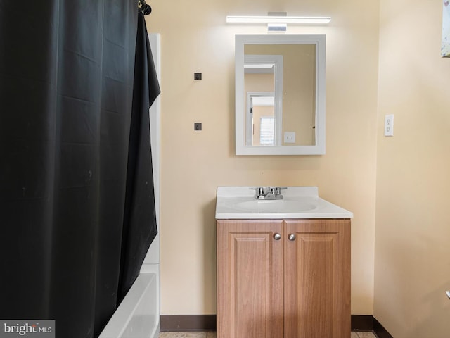 bathroom with baseboards and vanity