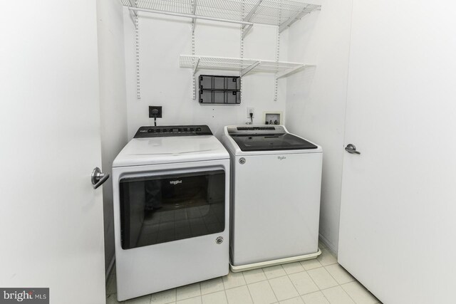 1688 N Quinn St, Arlington, VA 22209 - laundry area featuring independent washer and dryer and light tile patterned floors